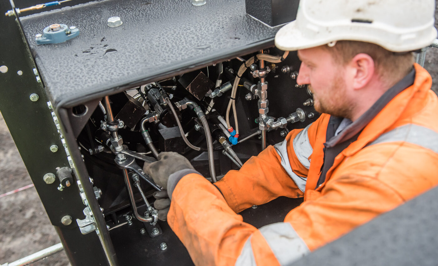 An Asphalt Burner Services engineer servicing burner pipework